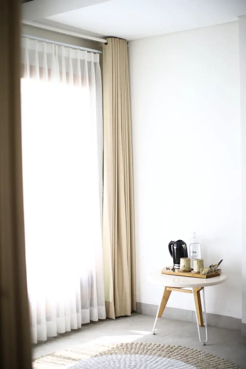 how-to-hang-sheers-behind-grommet-curtains