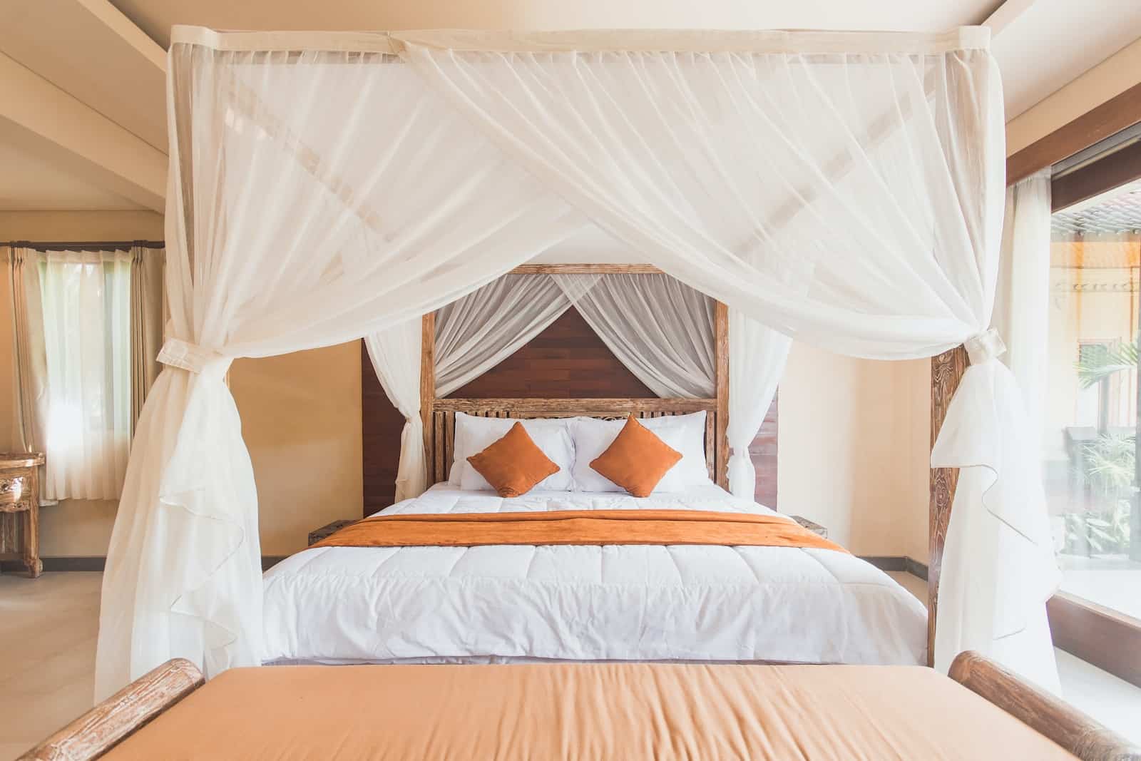 how-to-hang-curtains-on-a-canopy-bed